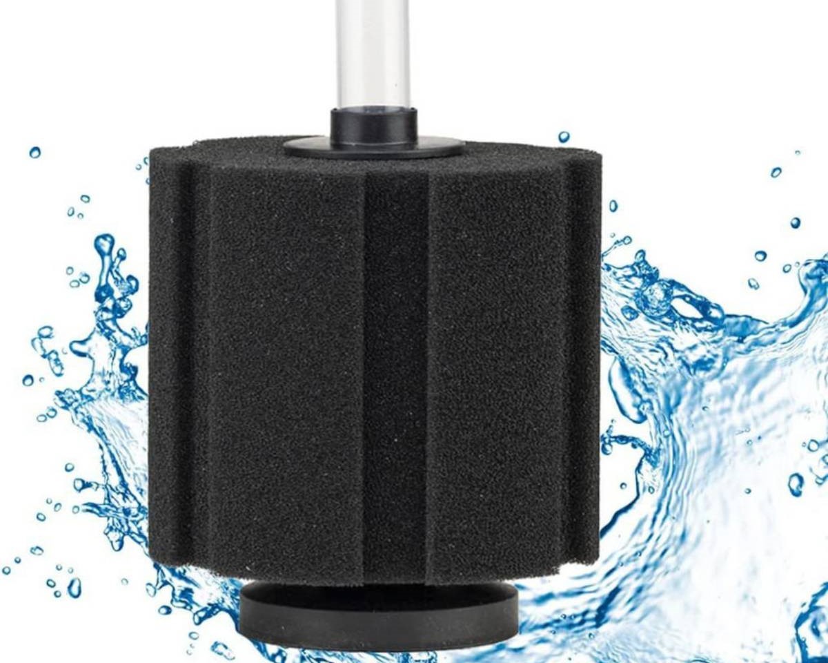 Black sponge filter with a clear tube, surrounded by splashes of water, used for aquarium filtration.